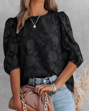 Elegante Chiffonbluse mit floralem Muster und verspielten Puffärmeln
